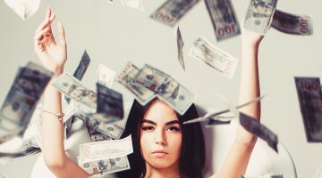 Millionaire Woman Lying In Bedroom. Sexy Woman Lying In Dollar B